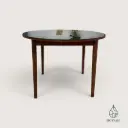 Table ronde allongeable en bois et verre fumé